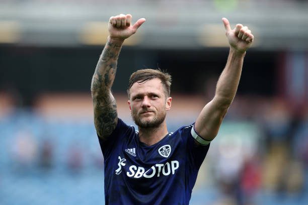 BURNLEY, ENGLAND - AUGUST 29: Liam Cooper of Leeds United interacts with the crowd following the Premier League match between Burnley and Leeds United at Turf Moor on August 29, 2021 in Burnley, England. Captains the TOTW (Photo by Jan Kruger/Getty Images)